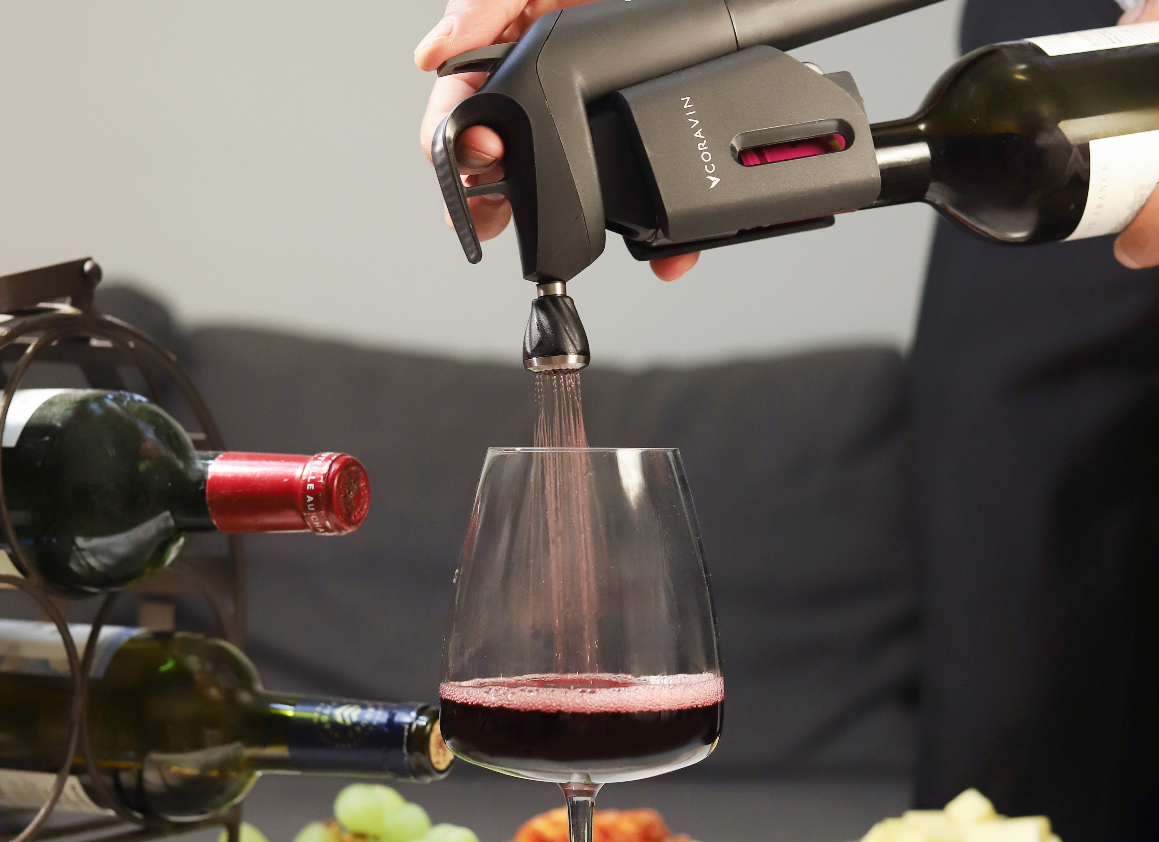 Coravin Model Three Wine Preservation System pouring red wine with the Aerator accessory attached